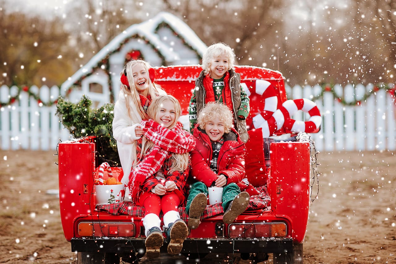 Related image four young blond kids red white winter clothes posing with tangerines