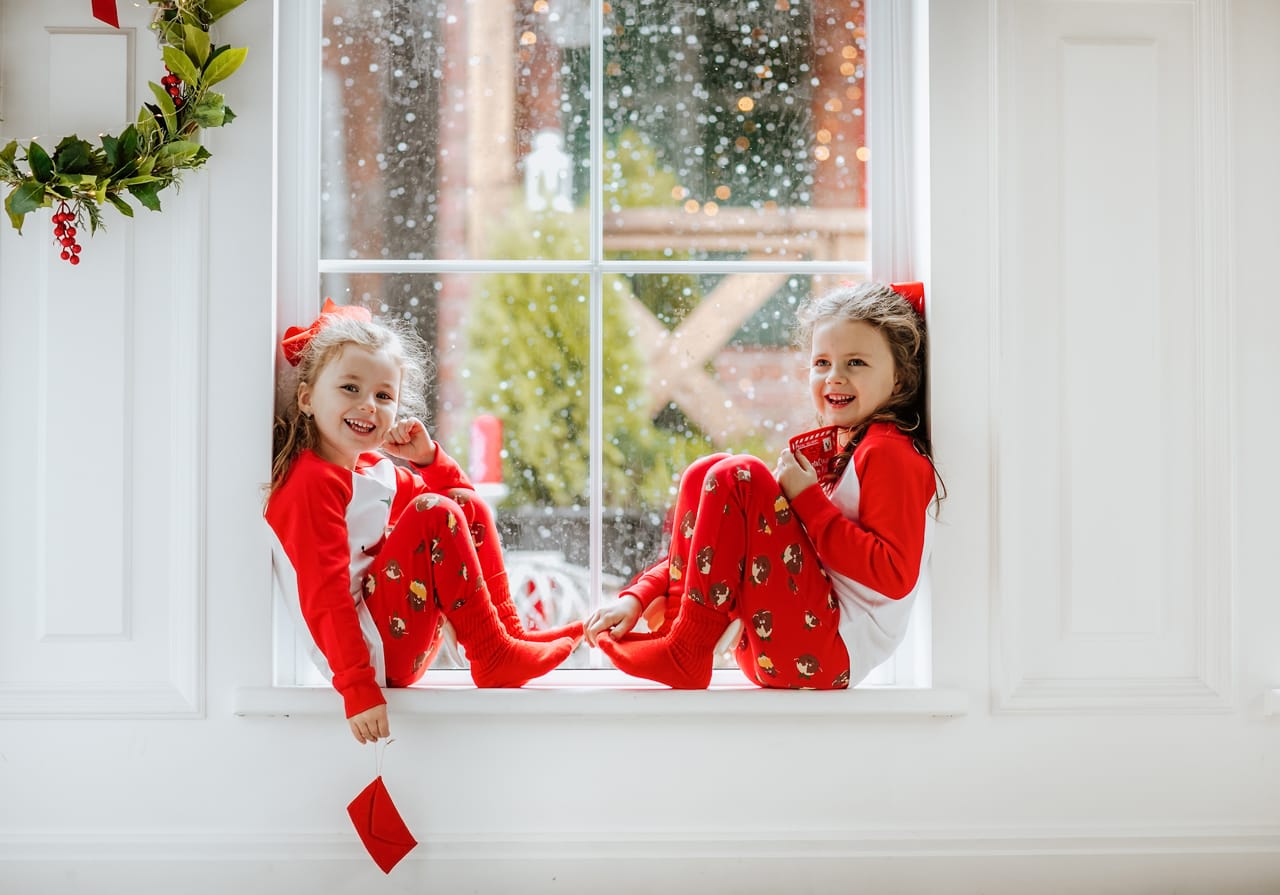 Related image two young pretty girls red white christmas pajamas bows posing big window