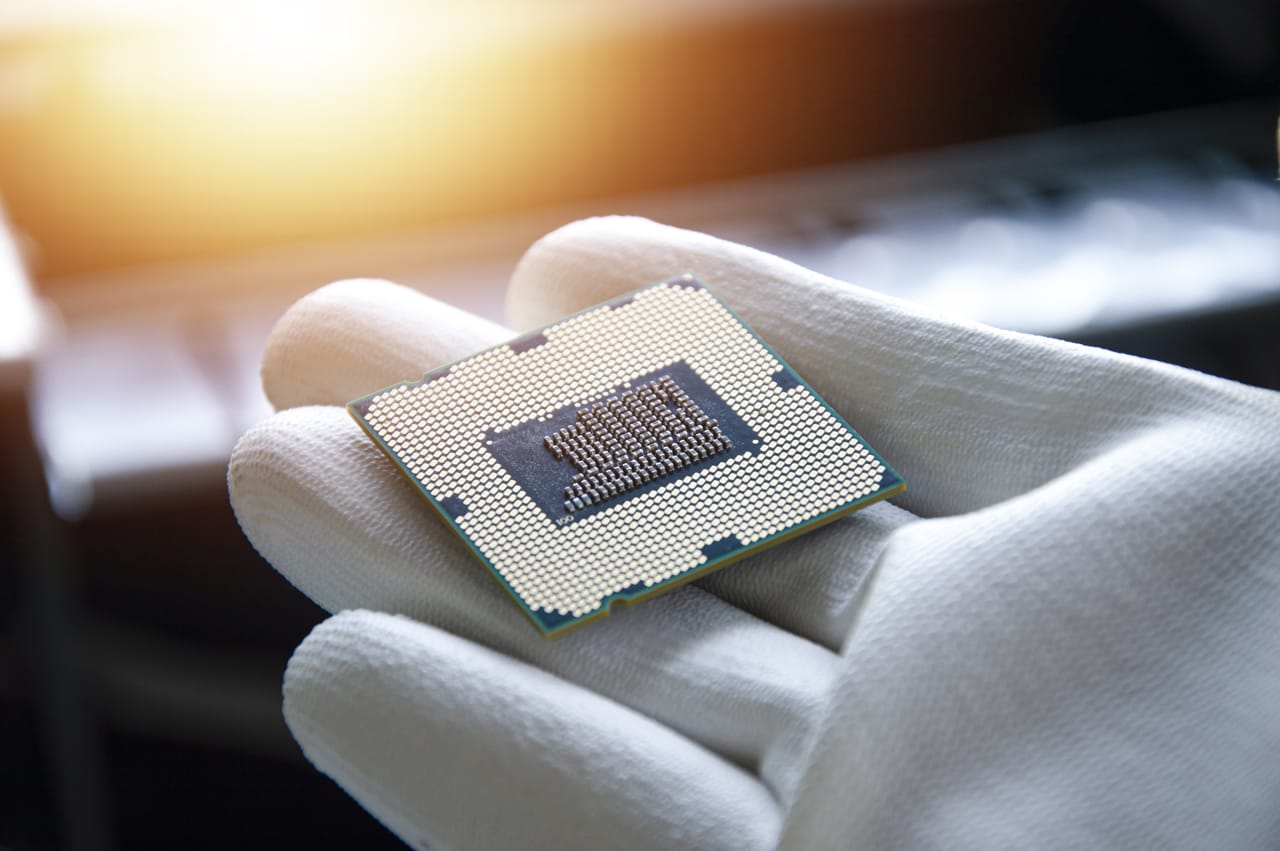 Related image image technician holding CPU his hand