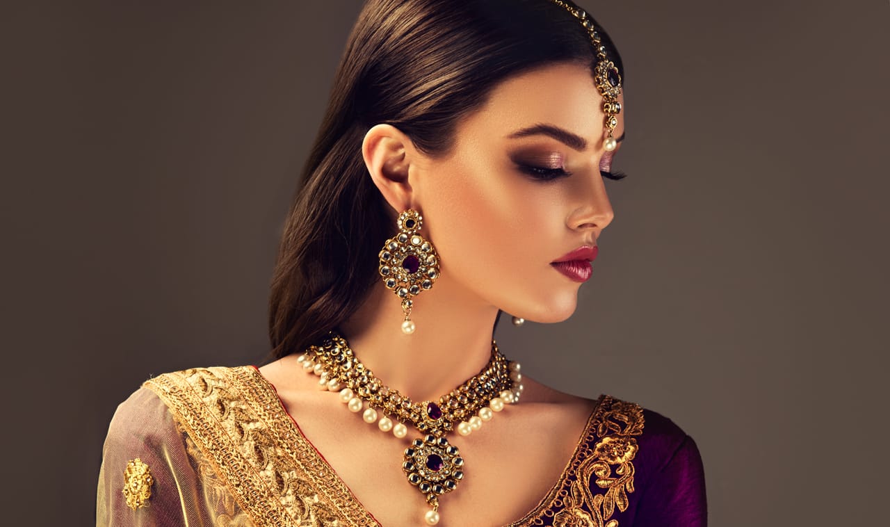 Related image black haired woman splendid makeup dressed traditional indian suit national jewelry set