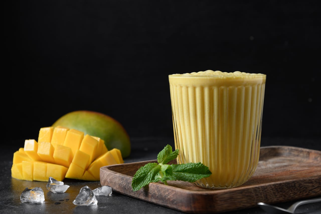 Related image mango turmeric lassi black background