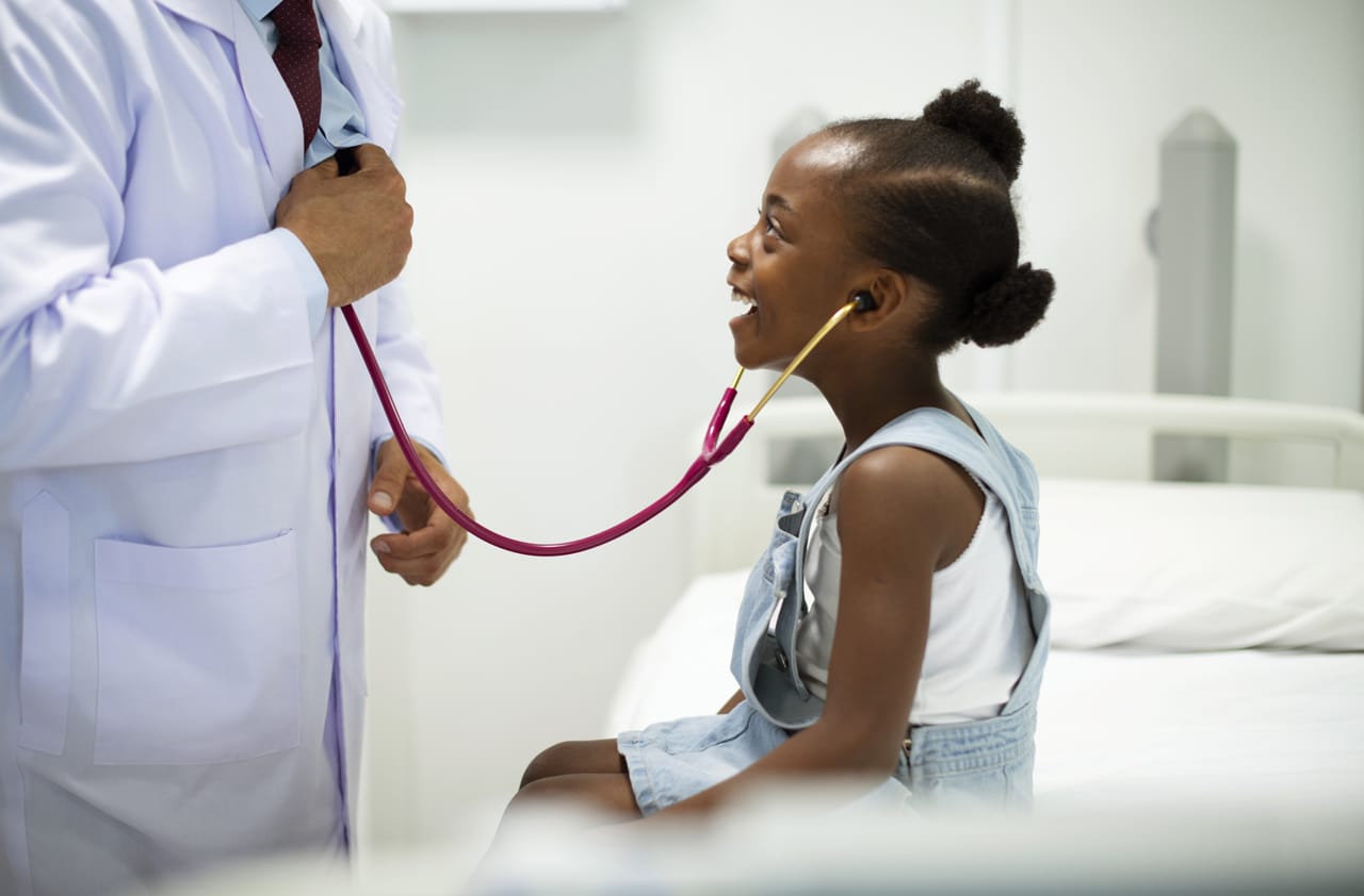 Related image friendly pediatrician entertaining his patient