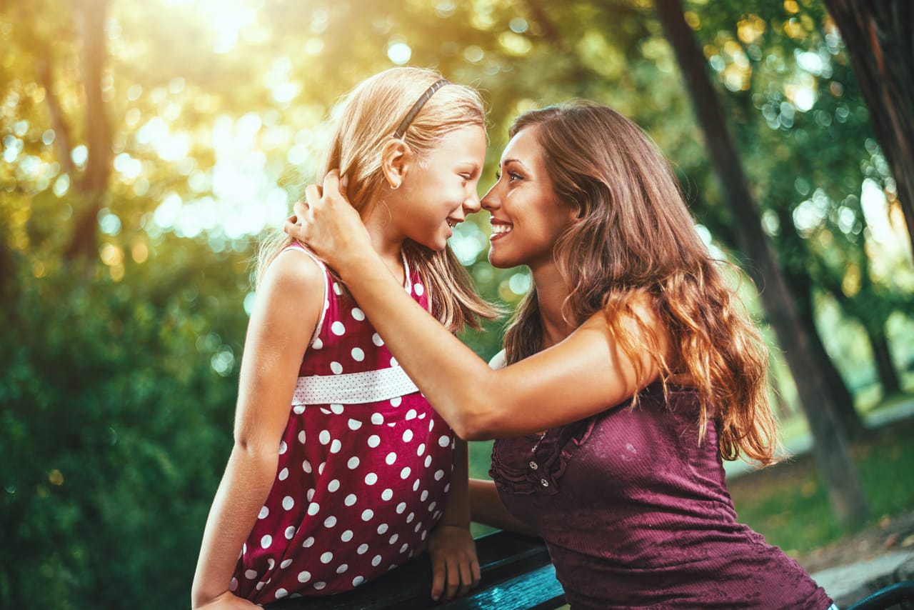 Related image happy cute little girl her mother are playing park they are hugging each other smiling